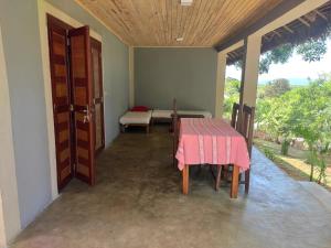 a room with a table and chairs and a window at Villa Métisse in Nosy Be