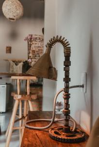 a lamp sitting on top of a wooden table at Vila hangloose Jericoacoara in Acaraú