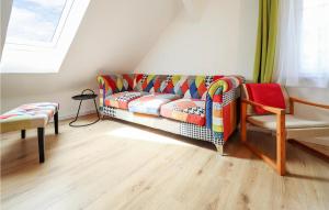 a living room with a couch and a window at Pet Friendly Home In Hirtenberg With Kitchen in Hirtenberg