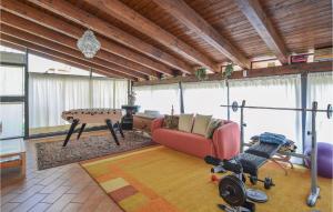 a living room with a couch and a table at Nice Apartment In Rogno With Outdoor Swimming Pool, Wifi And 1 Bedrooms in Rogno