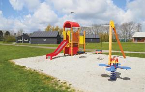 a playground with a slide in the sand at Stunning Home In Spjald With 2 Bedrooms And Wifi in Spjald