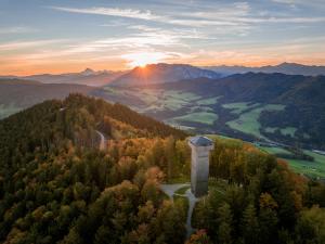 an aerial view of a mountain with the sun setting at Apartment Ferienwohnung DAS UNTERACH am Attersee in Unterach am Attersee