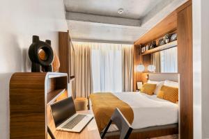 Posteľ alebo postele v izbe v ubytovaní CARD Hôtel