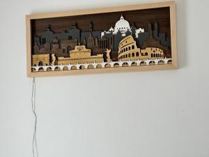 a picture of a city on a wall at Delizioso appartamento San Pietro in Rome