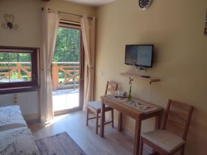 TV a/nebo společenská místnost v ubytování B&B L'Angolo Divino
