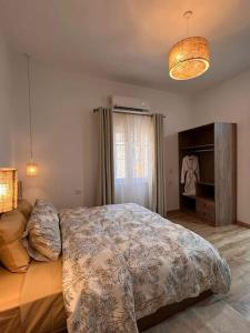 a bedroom with a large bed and a window at 2 bedroom apartement in the center of cairo in Cairo