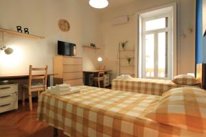 Ein Bett oder Betten in einem Zimmer der Unterkunft Residenza Accursio by BipHosting