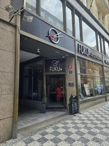 a front view of a clothing store in a building at Luxury apartment in the heart of Prague in Prague