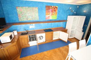 a kitchen with a sink and a washing machine at Villa Ca'Bianca in Bibione