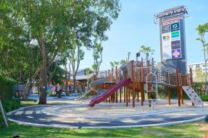 a playground with a slide in a park at Chabana Resort Bang-tao Beach Phuket- SHA Extra Plus in Bang Tao Beach