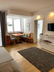 a living room with a couch and a table at Ferienwohnung Oberstdorf in Oberstdorf