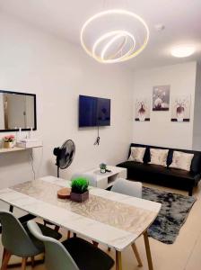 a living room with a table and a couch at VERDON PARC CONDOMINIUM in Davao City