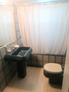 een badkamer met een toilet en een wastafel bij 6 pax Glyfada 2floor apartment in Athene