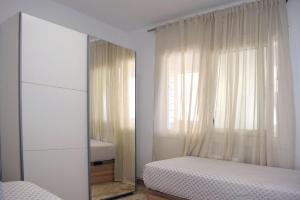 Posteľ alebo postele v izbe v ubytovaní Apartamentos Atlas Terrassa II