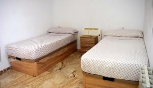 Posteľ alebo postele v izbe v ubytovaní Apartamentos Atlas Terrassa II