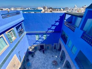 an overhead view of a blue building with a balcony at Dar Lekbira Boutique Hôtel in Sousse