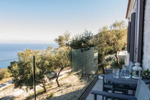 a balcony with a view of the ocean at TOPAZ AGIOS NIKITAS in Agios Nikitas