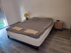 Gite de l'Alsace Bossue tesisinde bir odada yatak veya yataklar