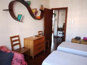 A bed or beds in a room at Checchi House
