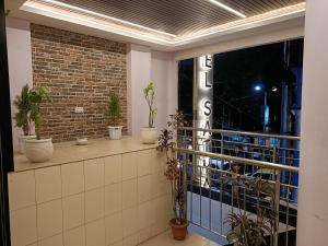 a room with potted plants on a window sill at Hotel Satyam in Jaigaon
