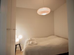 Un pat sau paturi într-o cameră la Nordic Quality Apartments- Feel the North