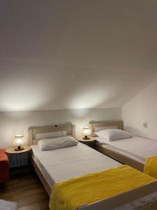 מיטה או מיטות בחדר ב-Vikendica Silenzio