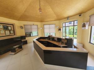 a large kitchen with a large island in a room at Hotel Sanctuary Resort in Sawāi Mādhopur