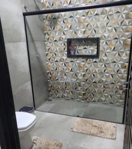 a bathroom with a shower with a toilet at Império D in Tanabi