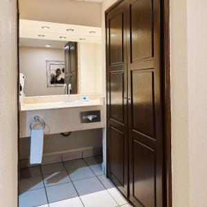 a bathroom with a sink and a mirror at Sea of Cortez Beach Club in San Carlos