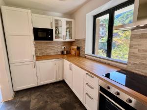 A kitchen or kitchenette at Vila Labod, Unique Villa At The Lake