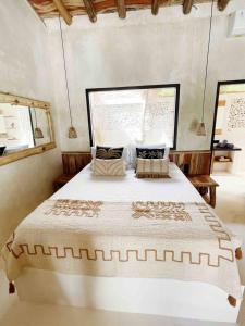 A bed or beds in a room at Angatu Villas 3 Padang Padang