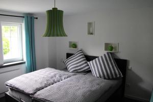 a living room with a couch and a window at Sallinghaus in Eslohe