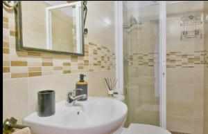 a bathroom with a sink and a toilet and a shower at Casa la limosna in Setenil +51 photos