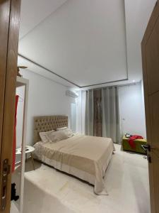 a bedroom with a large bed in a room at Lux appartment khezama sousse in Sousse