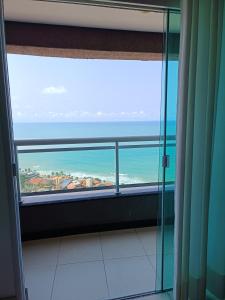 a view of the ocean from a bathroom window at Apartamento Duna Barcane 1801 in Natal