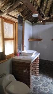 a bathroom with a sink and a toilet at Ecohab -Parque Tayrona in Santa Marta