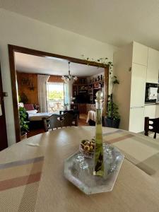 a living room with a table with a vase on it at Apartments Korta in Račišće