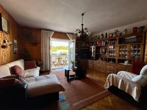 a living room with a couch and a table at Apartments Korta in Račišće