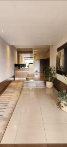 a large room with a large white tile floor at Home in Río Cuarto