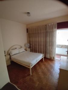 Postel nebo postele na pokoji v ubytování T3 1 andar Avenida Ref 003