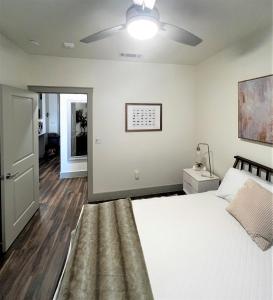 a bedroom with a bed and a ceiling fan at 1 BR w Balcony View Resort Pool Free Parking in Addison
