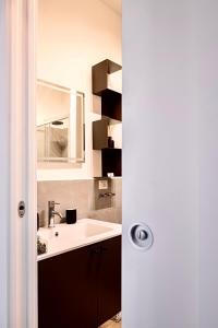 a bathroom with a sink and a counter top at Apartment Vitale in Bologna +20 photos