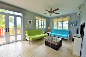 a living room with a couch and a table at Luxury Villa Bonita Sleep 50 + in Isabela