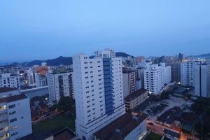 an overhead view of a city with tall buildings at Praia do Gonzaguinha em São Vicente in São Vicente