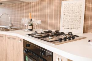 Kuchyň nebo kuchyňský kout v ubytování Artemide Apartment