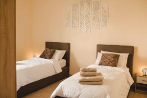 Postel nebo postele na pokoji v ubytování Artemide Apartment