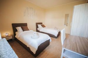 Postel nebo postele na pokoji v ubytování Artemide Apartment