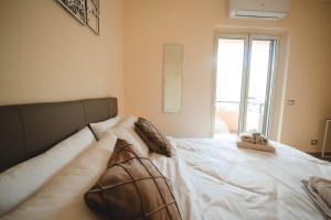 Postel nebo postele na pokoji v ubytování Artemide Apartment