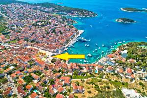 an aerial view of a city with a yellow arrow at Main Square Apartment in Hvar