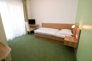 Postel nebo postele na pokoji v ubytování Hotel Bauer